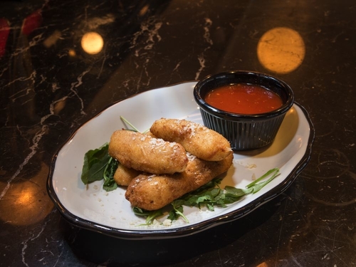 The happy hour mozzarella sticks with marinara sauce