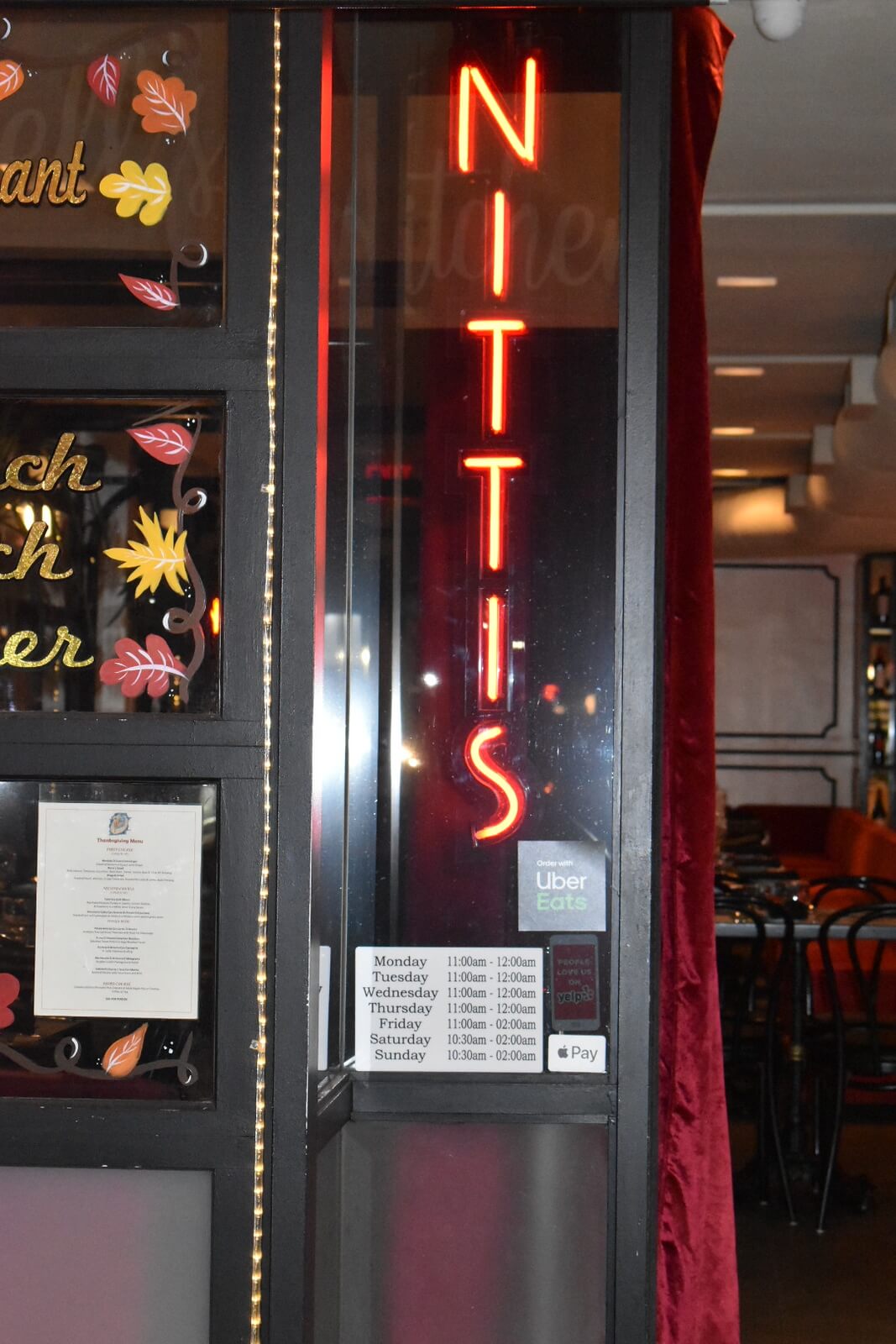 Nittis written in red neon lights in the window